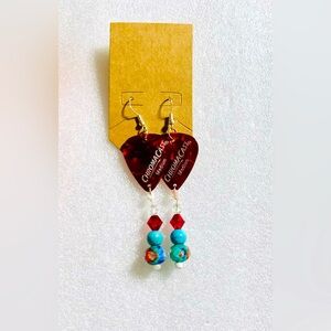 Red fender dangling earrings